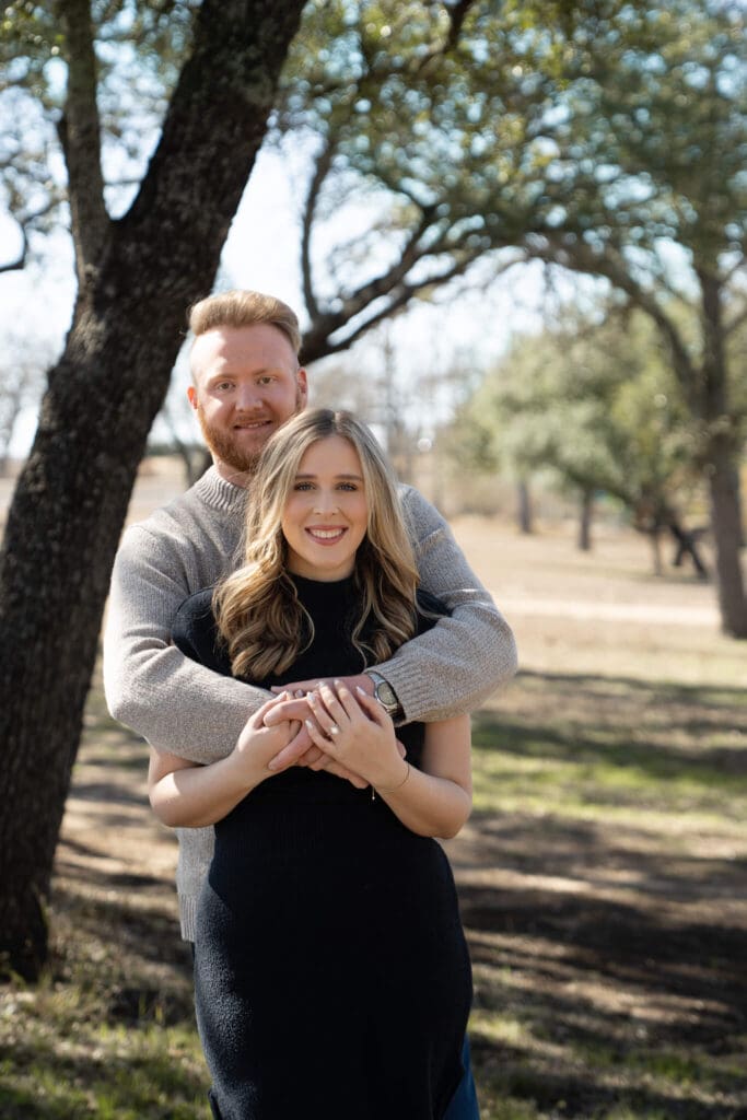 Candid photo of couple laughing during Austin vineyard session
