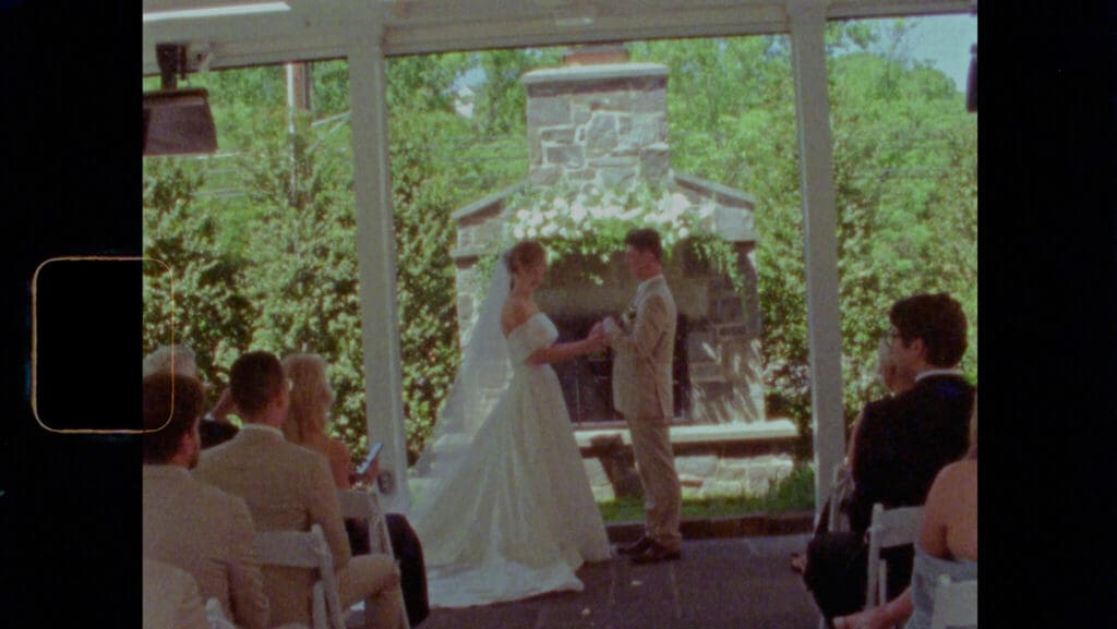 Super 8 wedding film still of a couple walking near historic Washington DC architecture
