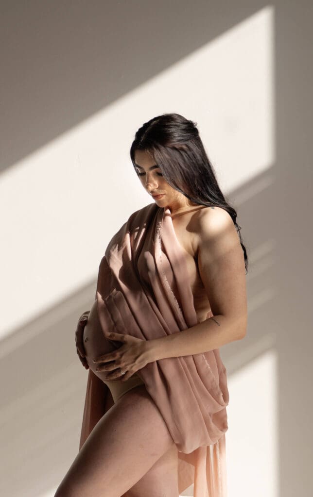 Soft natural light in a boho maternity session at The Lumen Room