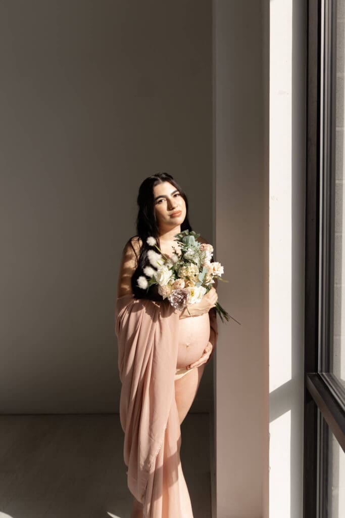 Warm golden light highlighting a boho maternity session in Austin