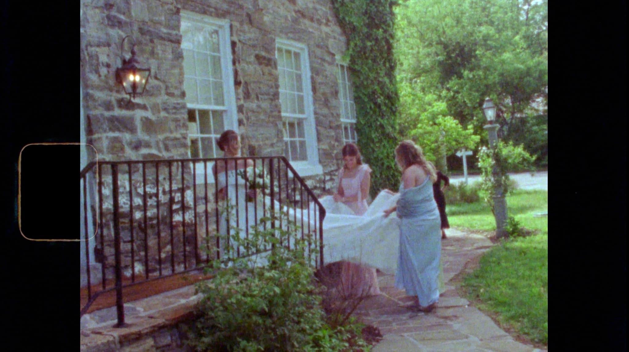 Romantic Super 8 film still capturing a couple in motion at golden hour, with soft grain and nostalgic warmth.