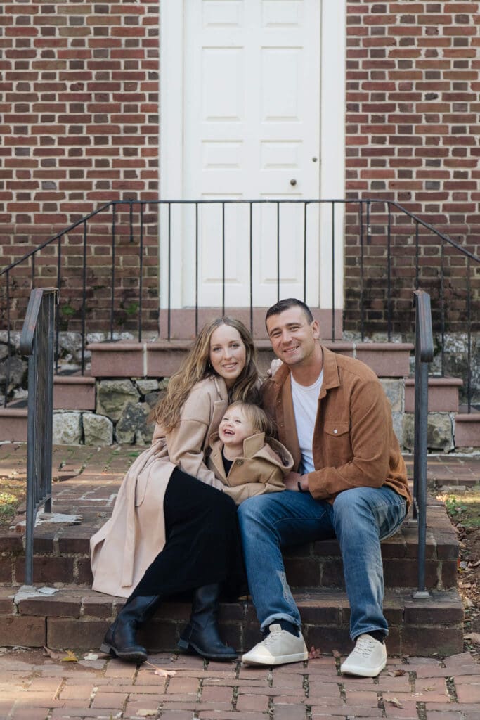Parents and children sharing a moment during a lifestyle family session in Austin