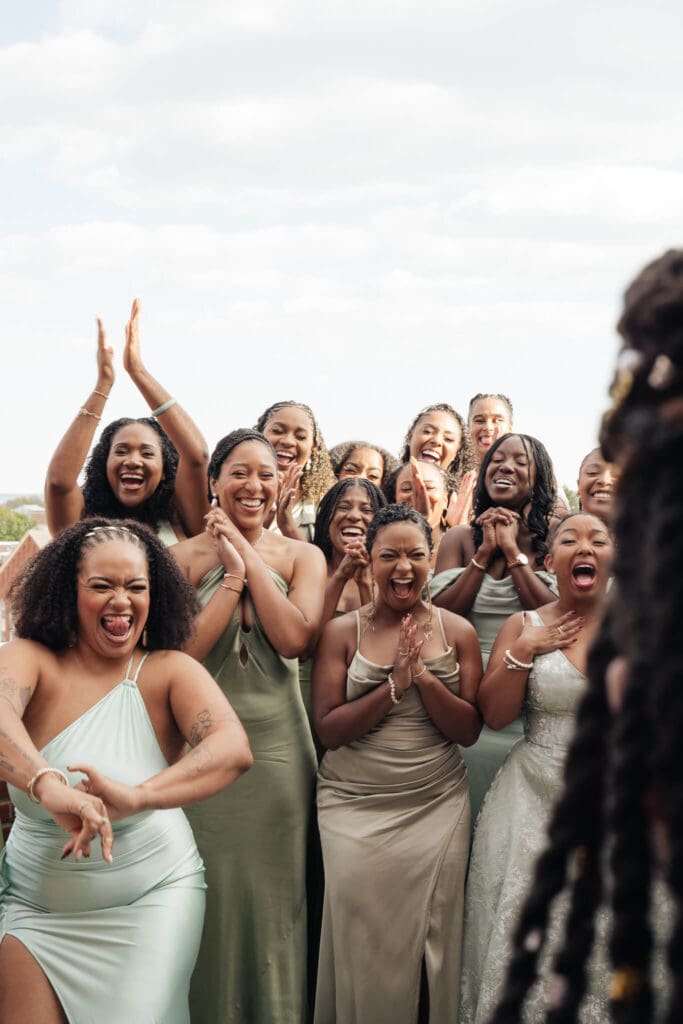 Couple jumping the broom as part of a meaningful wedding tradition
