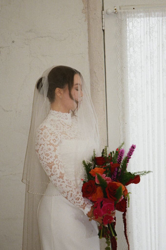 Bride’s veil flowing during portraits at Villa Antonia in Texas