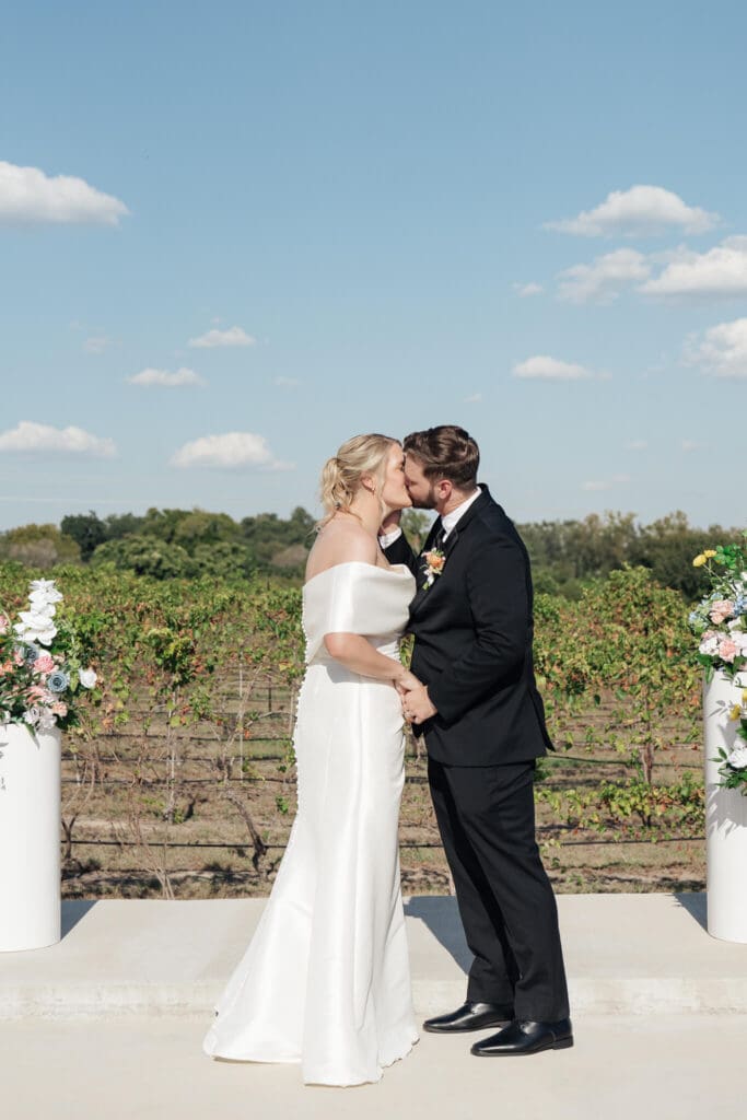 Couple exchanging vows during outdoor ceremony
