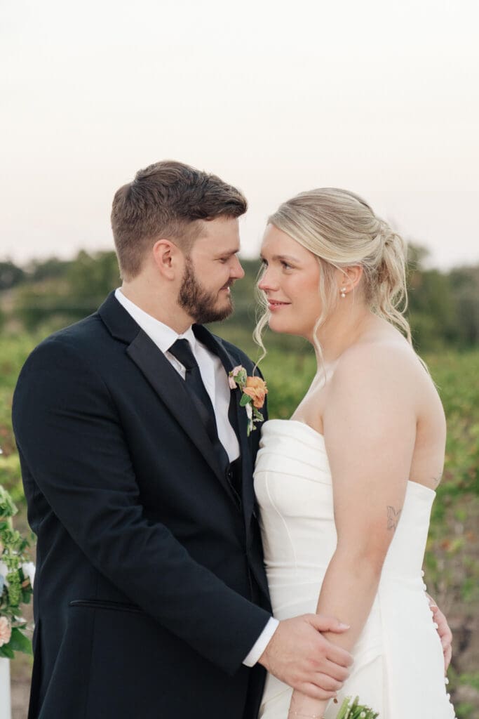 Couple hugging during private first look
