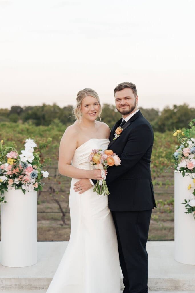 Reception table with florals and elegant place settings
