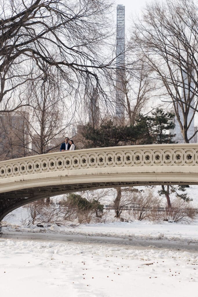 Bride and groom standing on subway platform together