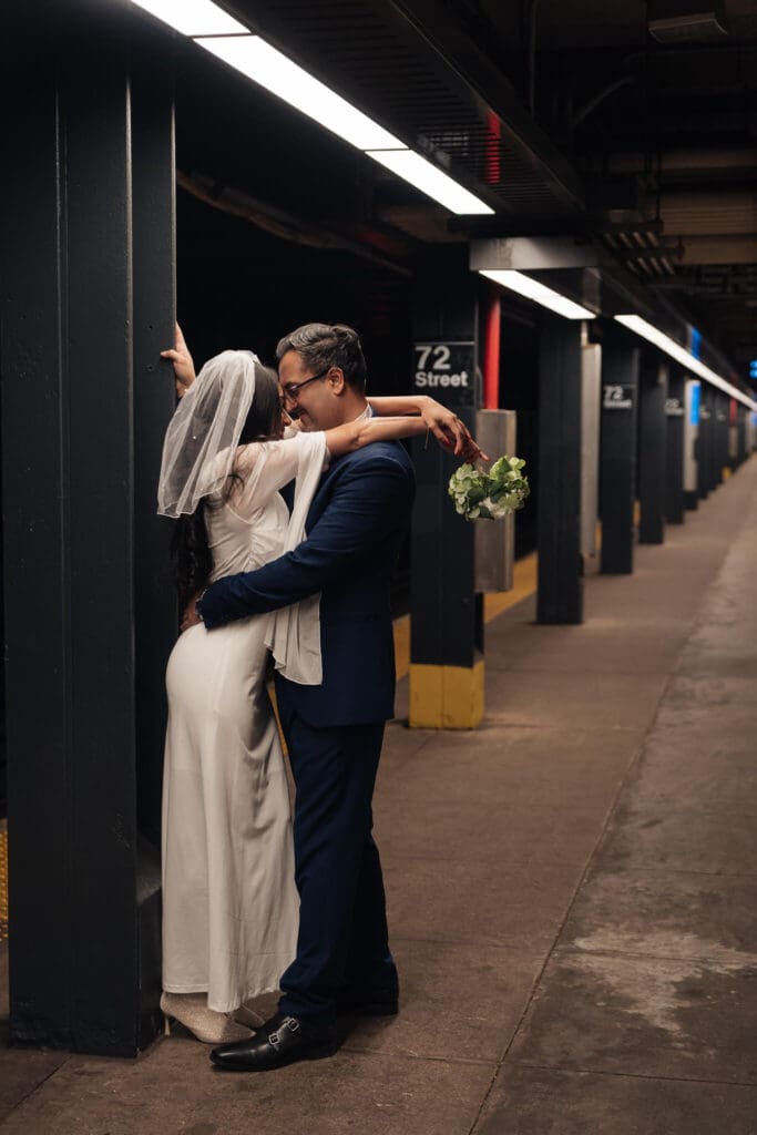 Motion blur of train passing couple in formal attire