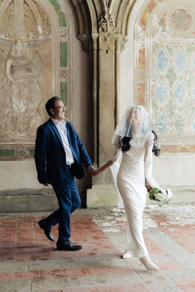 Candid moment of couple laughing during portraits