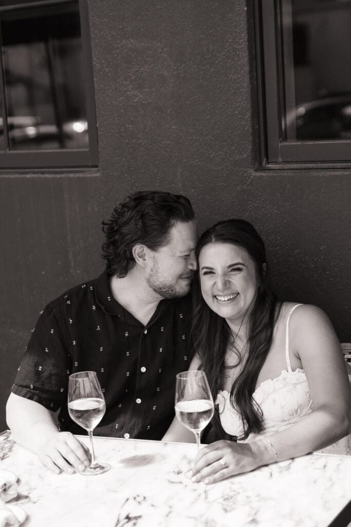 Candid laughter during engagement photos in Austin on South Congress
