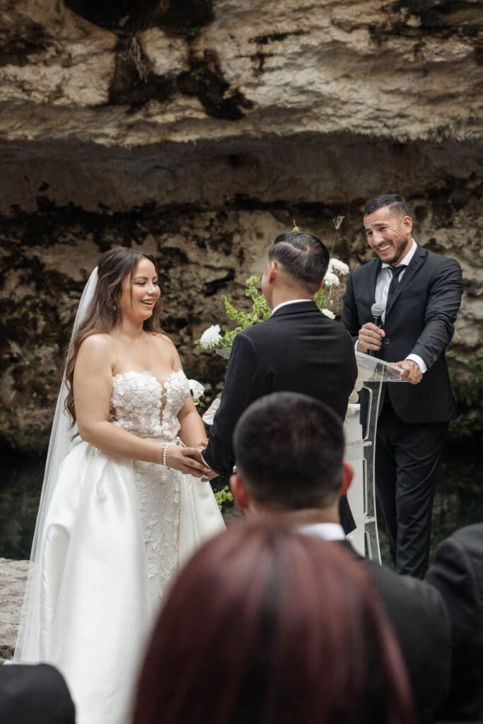 Destination wedding ceremony inside Cancun cenote