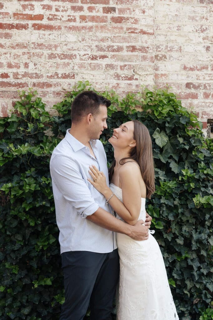 Couple sharing coffee during a romantic engagement session in Georgetown Washington DC
