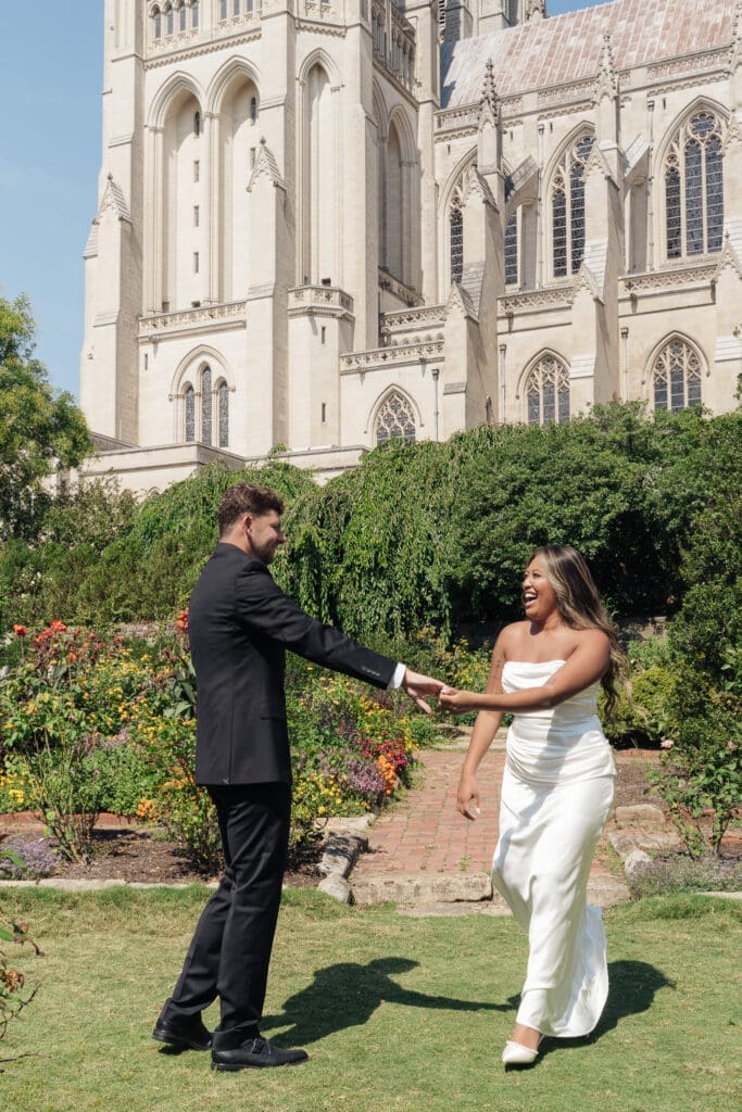 Couple embracing during summer engagement session at the National Cathedral