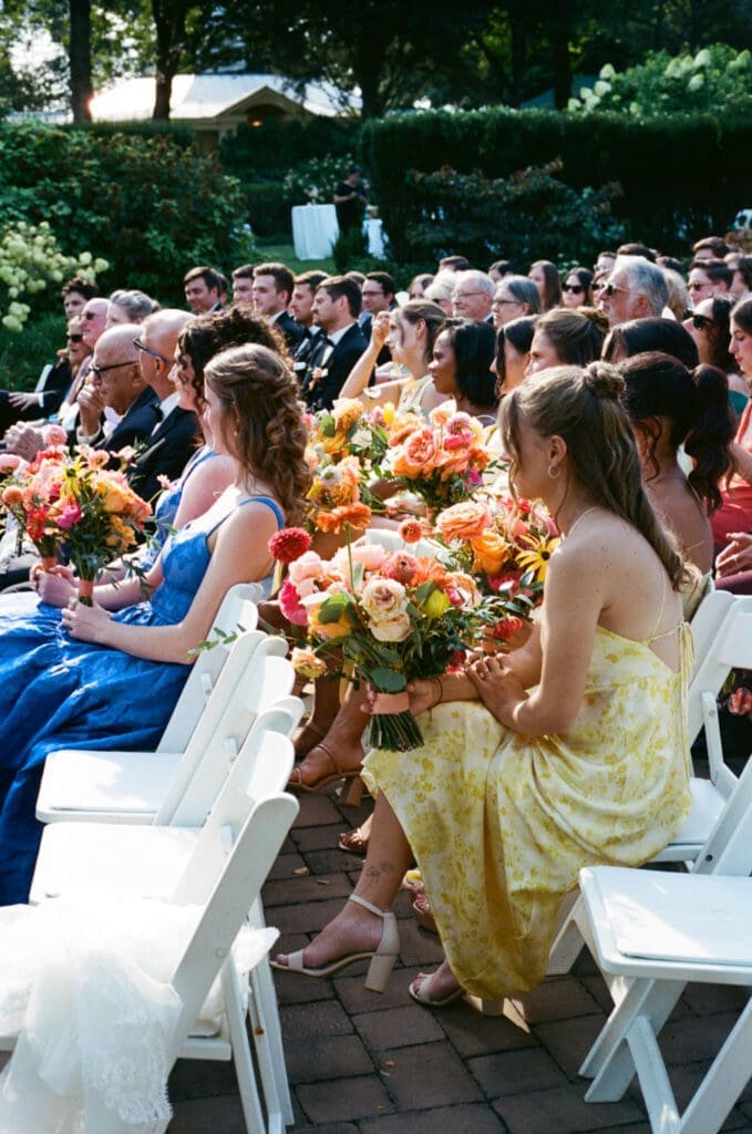 Newlywed portraits beneath trees during golden hour