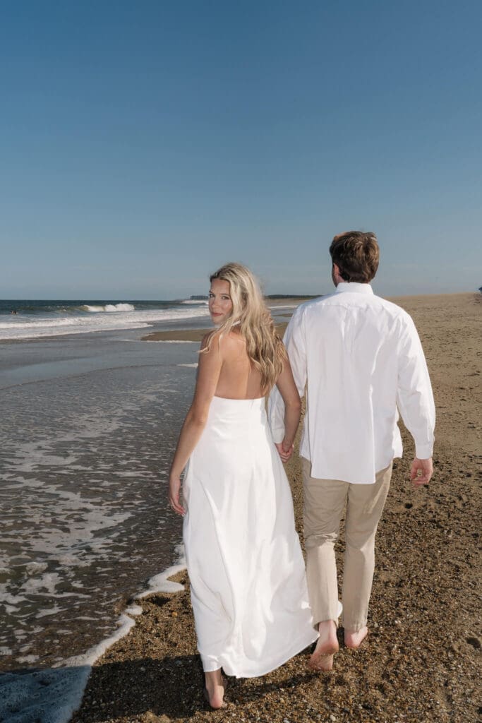 Editorial style couple portraits photographed along the Delaware coastline at sunset