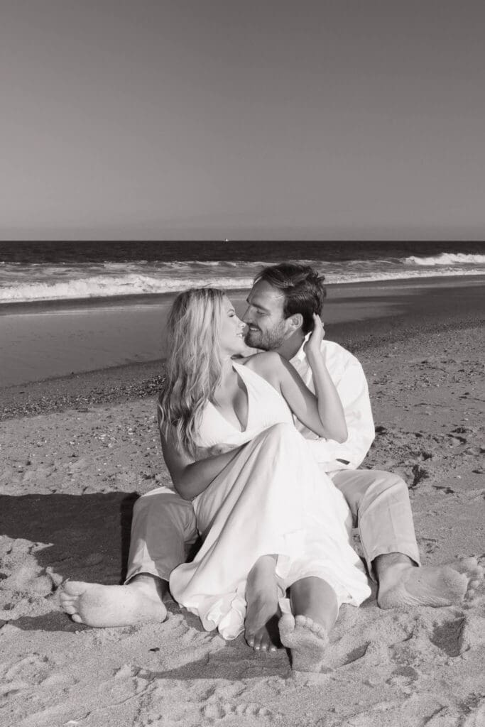 Documentary engagement photography capturing movement and authentic connection near the ocean