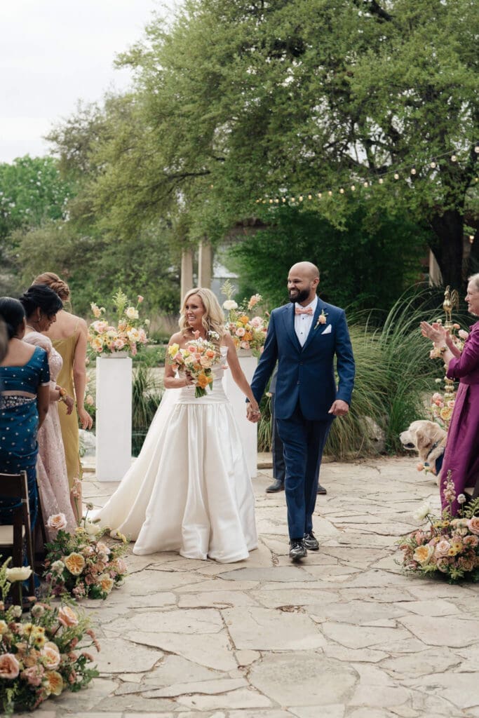 Documentary-style spring wedding floral inspiration featuring candid laughter between newlyweds