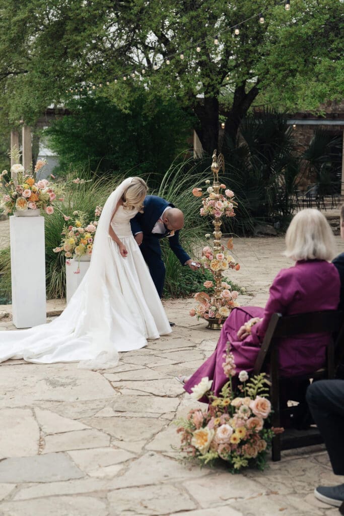 Outdoor wedding ceremony surrounded by native Texas flowers at Lady Bird Wildflower Center