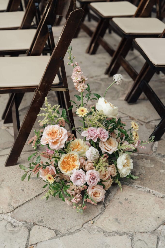 Colorful floral design blending bold and pastel tones for a spring wedding