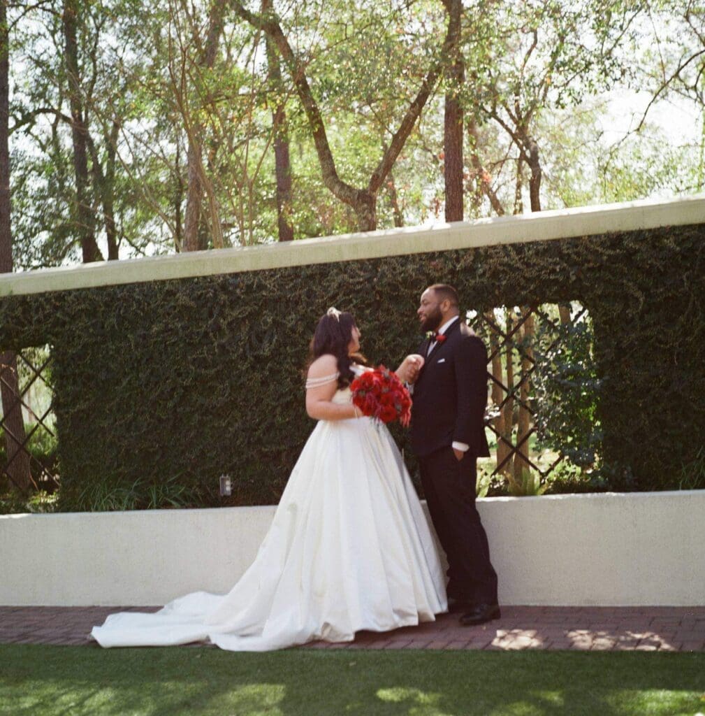 Bride and groom dancing together during the reception captured by film wedding photographer