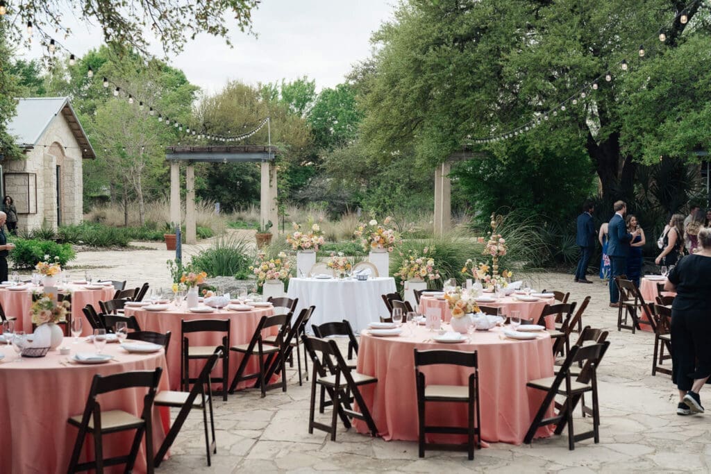 Newlyweds celebrating together in a colorful garden setting after their ceremony